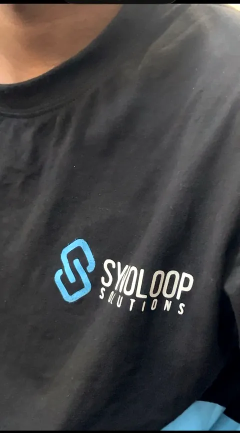 The Synoloop Solutions logo on a team T-shirt